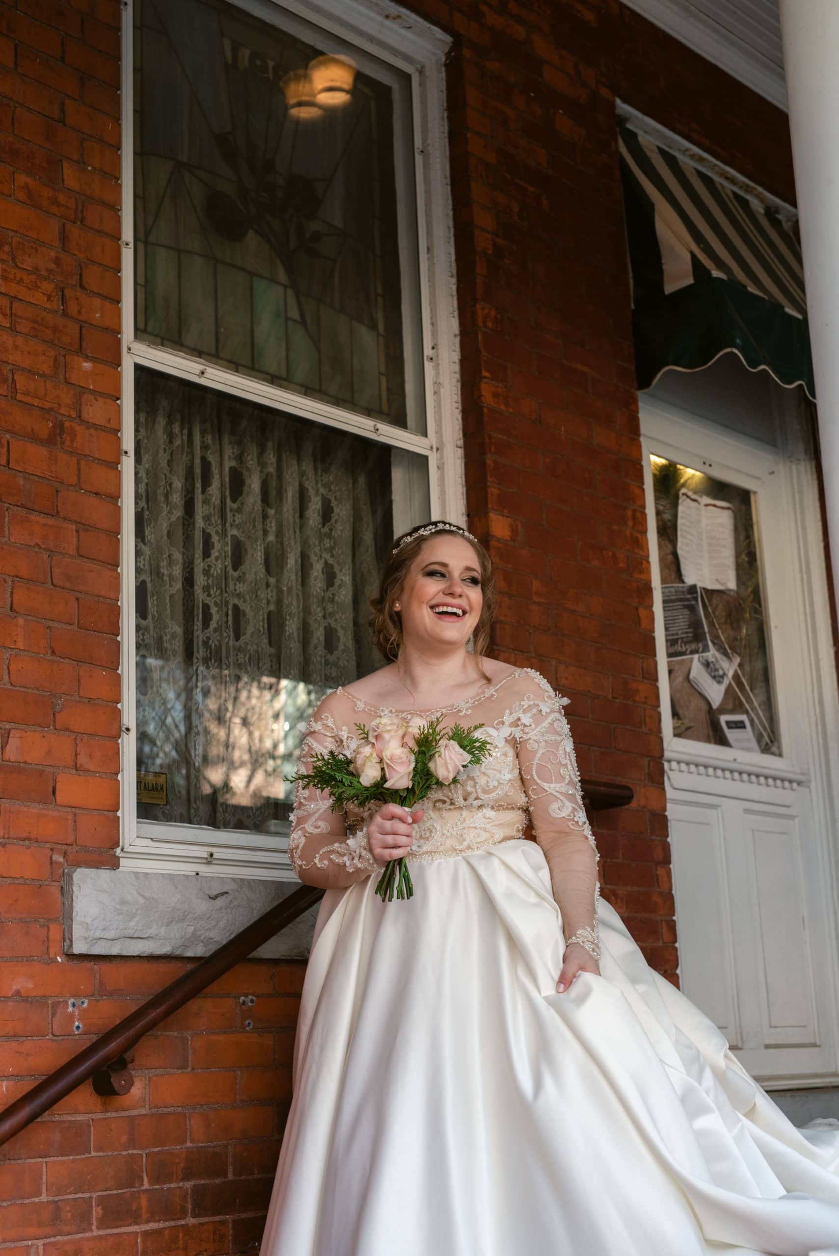 Bride walking down the stairs at the Historic Holly Hotel.
