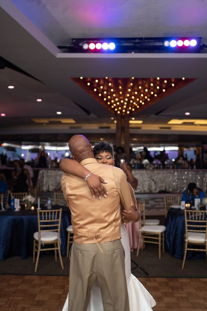 Bride and Father's first dance during the wedding reception at Roostertail in Detroit.