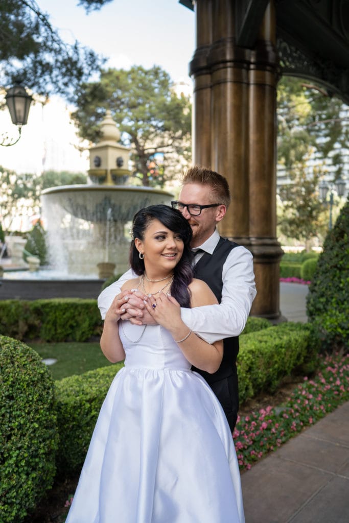 Couple eloping in Vegas on Bellagio porch.