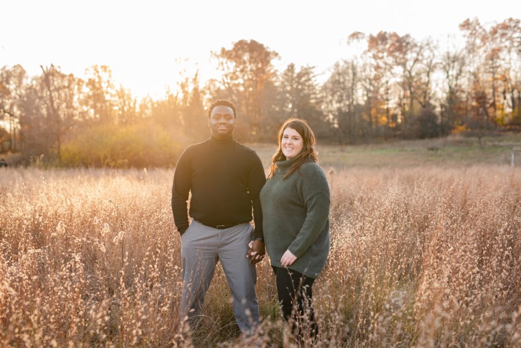Couple posing during family photos at Golden Hour.