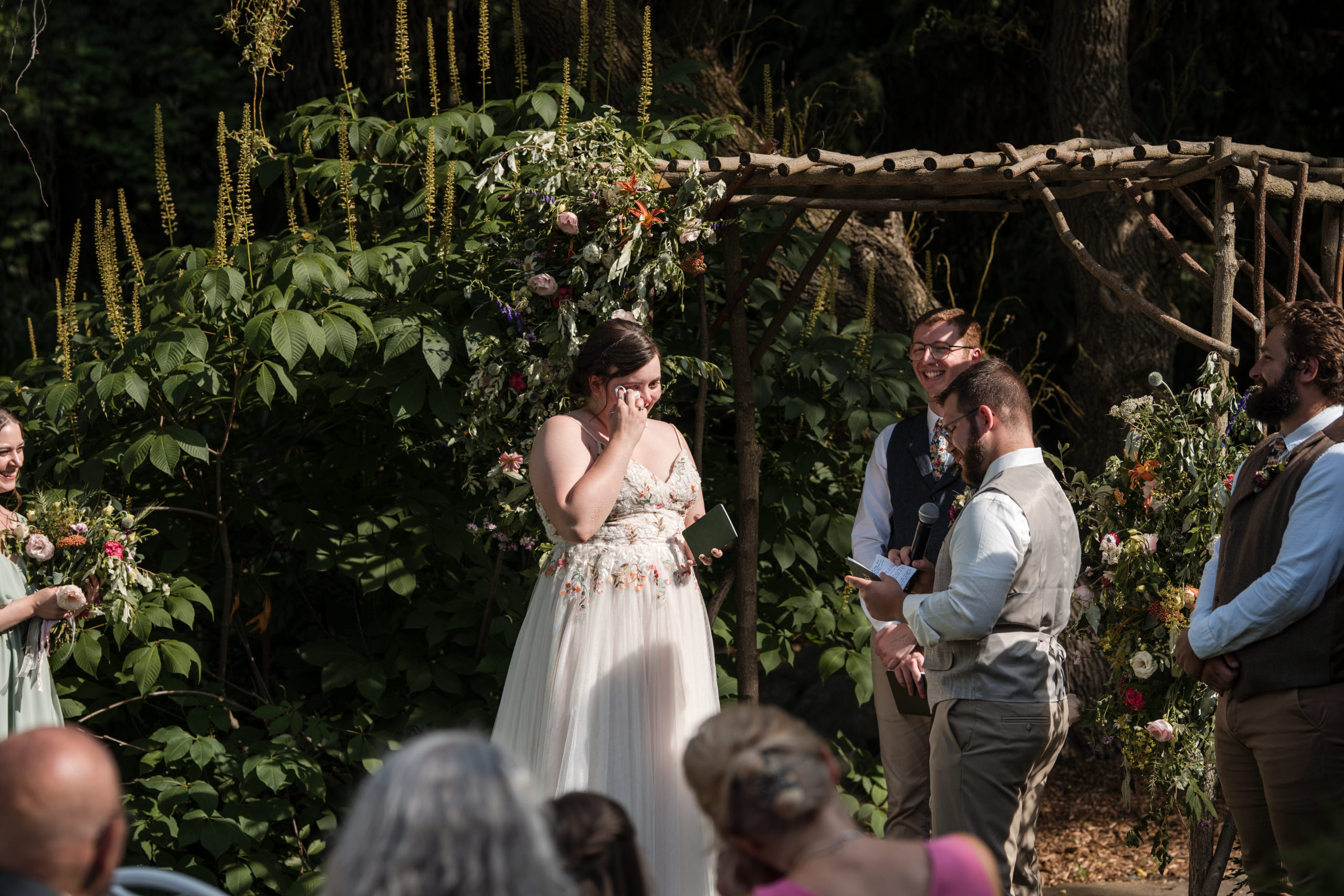 bride and groom exchanging wedding vows in a secluded garden ceremony.