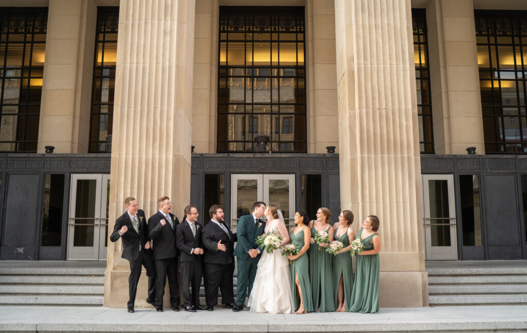 wedding party on the steps of the civic center in grand rapids
