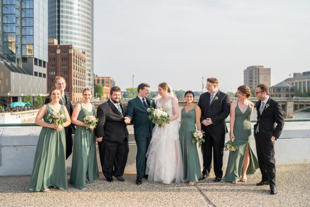 Wedding party with Bride and Groom standing on a Bridge in downtown Grand Rapids